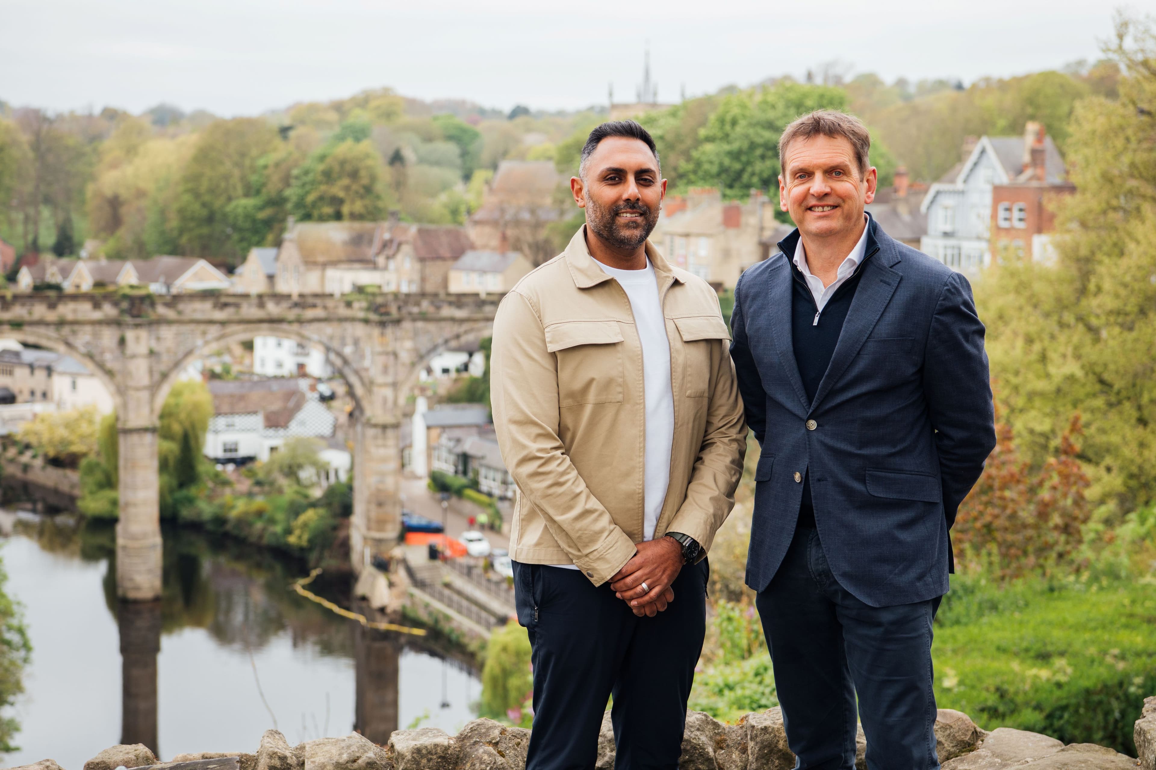 Two men standing with Knaresborough Viaduct and River Nidd