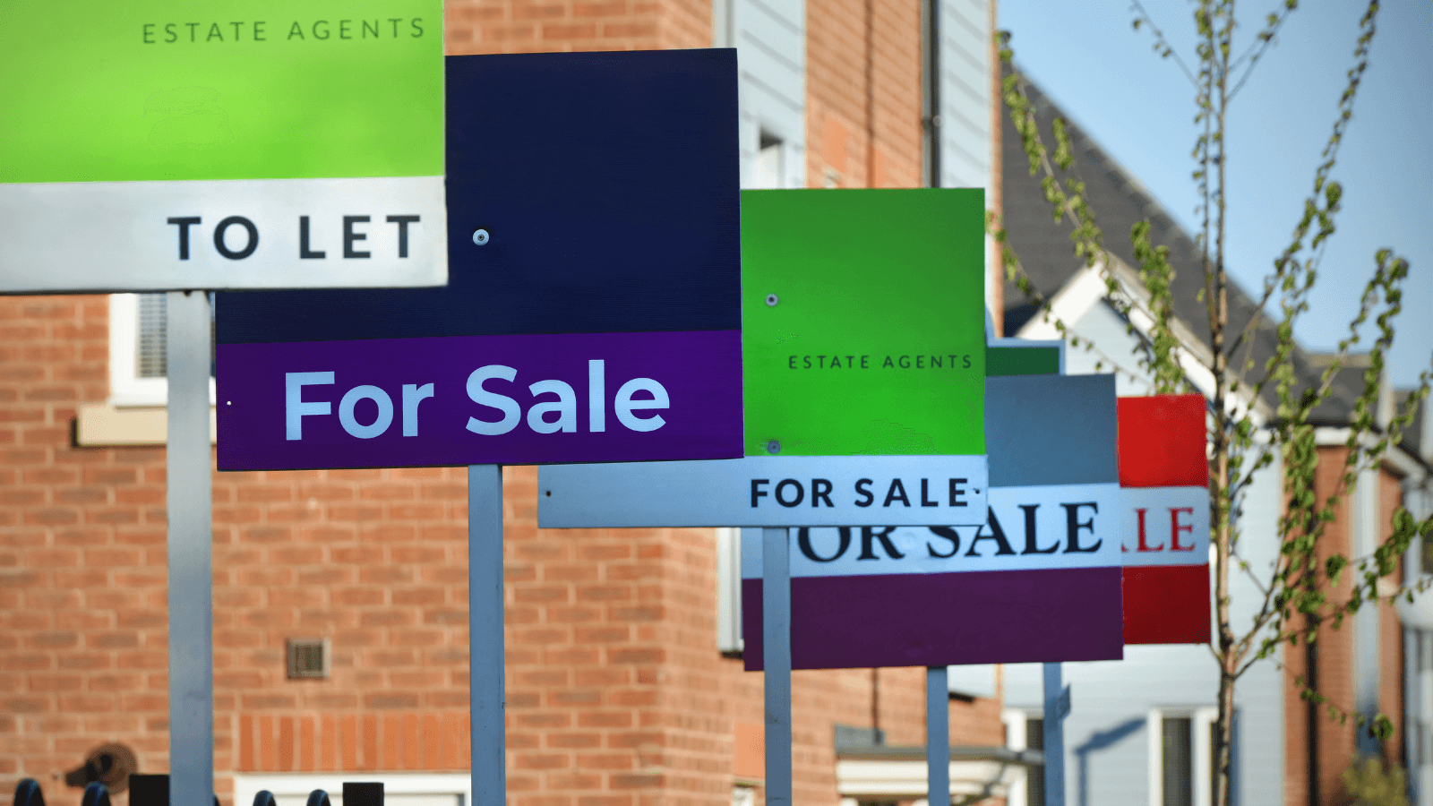 Colorful estate agent signs for sale and to let in Yorkshire