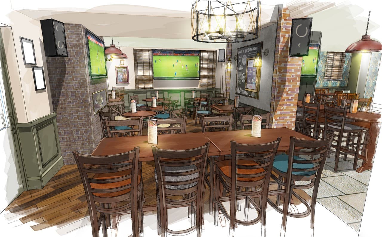 Cozy Yorkshire pub interior with wooden tables and sports on TV