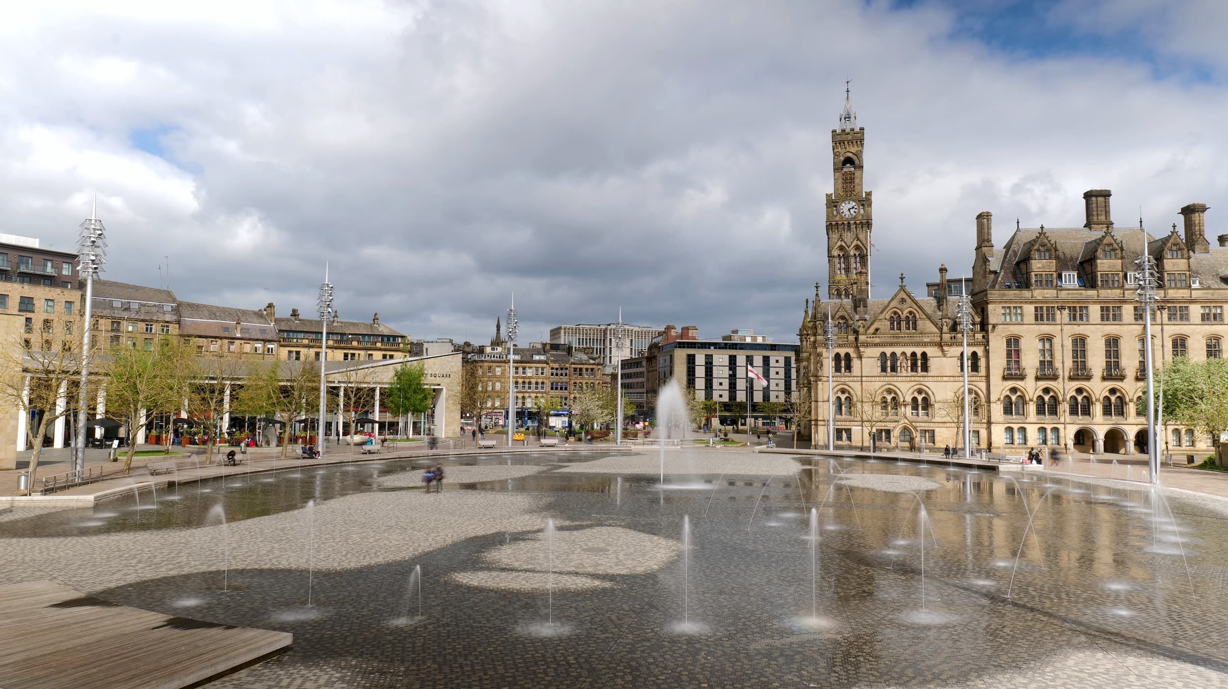 Bradford City Park with fountains and historic buildings