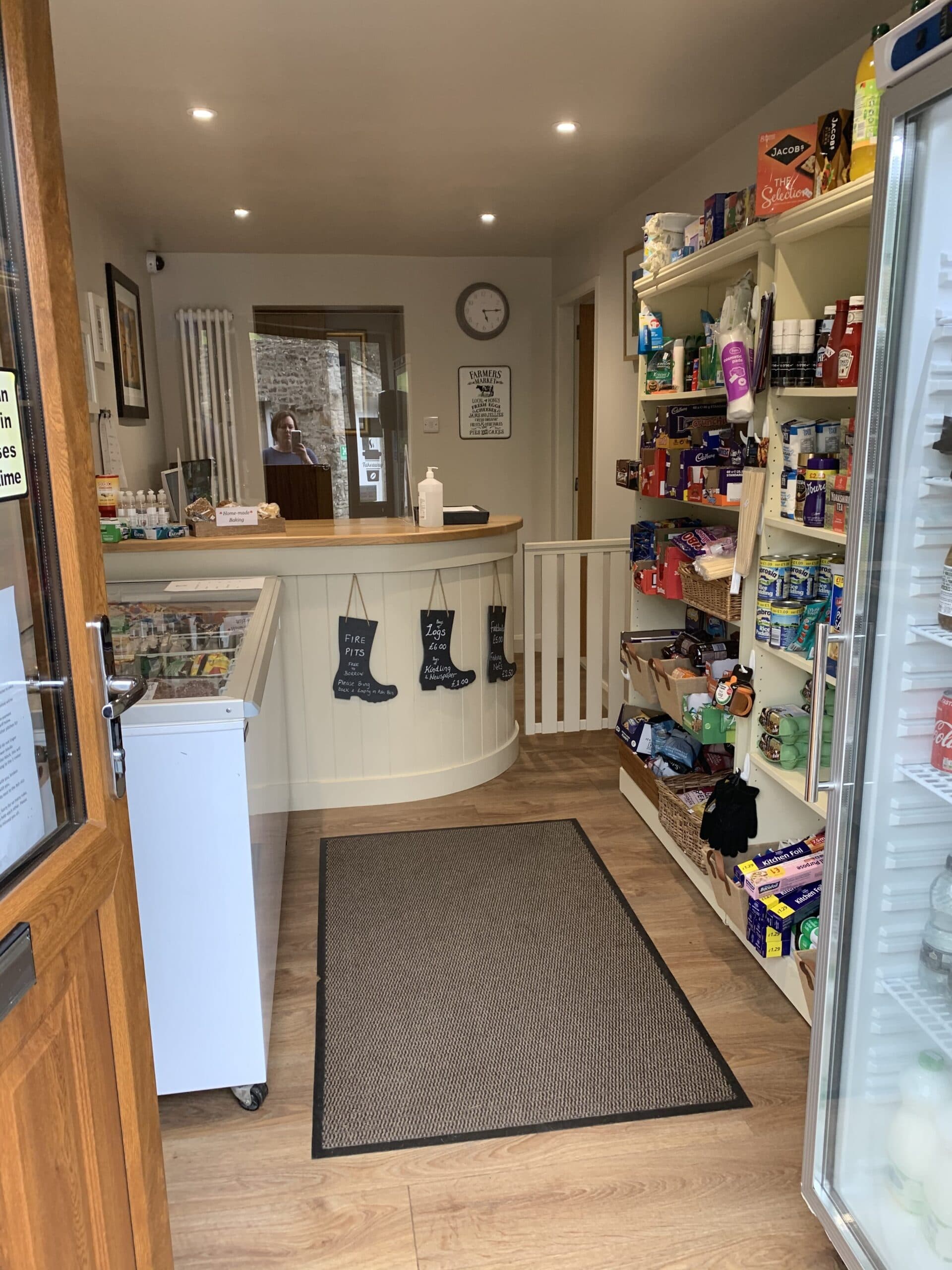 Campsite shop with shelves of snacks, drinks, and camping essentials