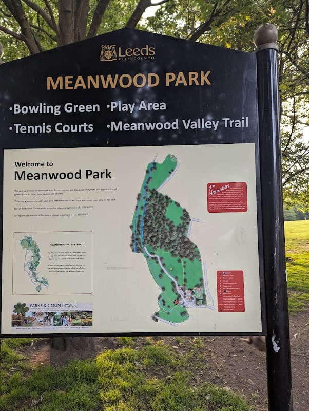 Sign for Meanwood Park featuring a map, listing amenities like a bowling green, play area, and tennis courts.