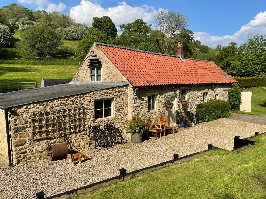 Mill Cottage with waterfall in North Yorkshire