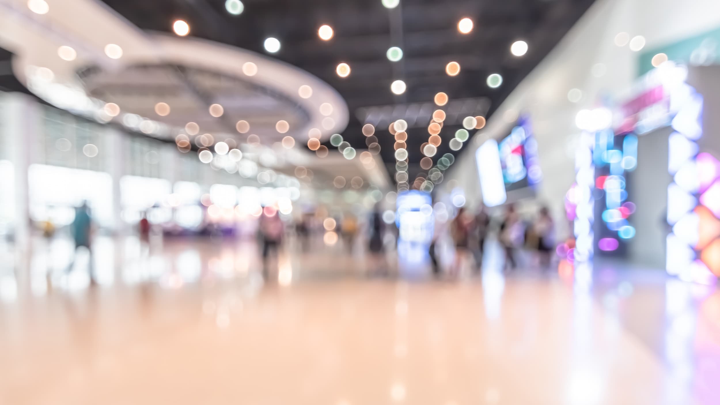 Blurred view of a modern shopping mall with lights