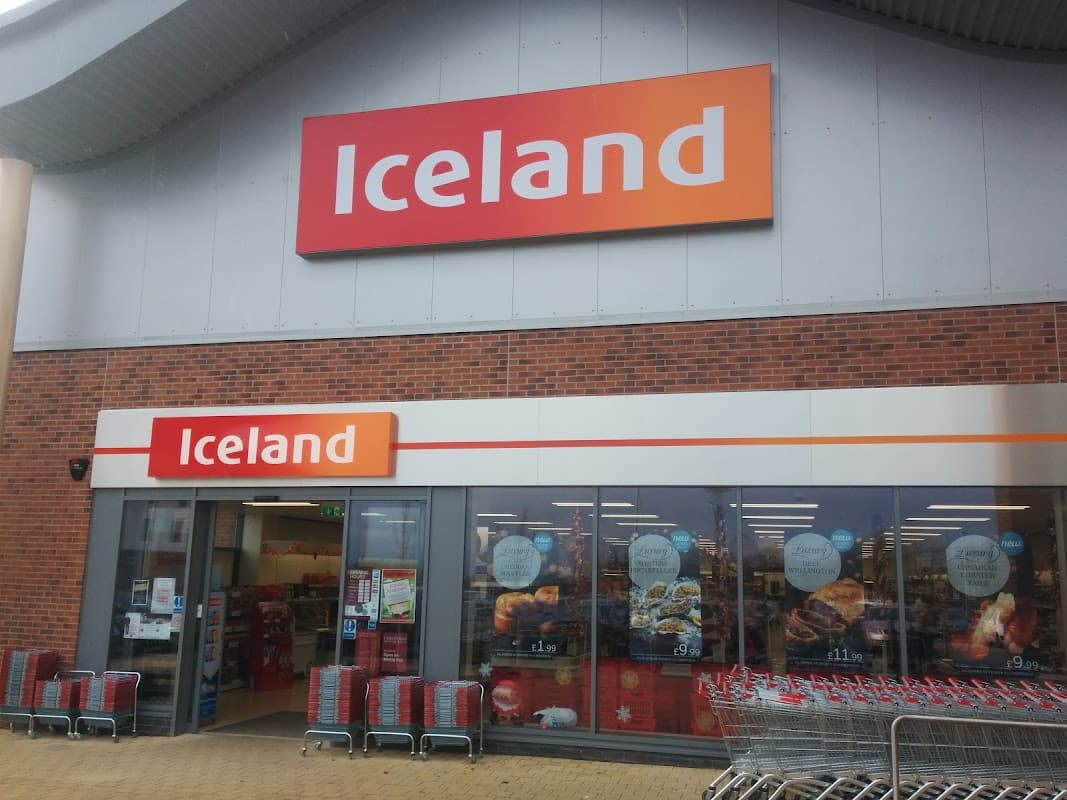 Iceland supermarket exterior with large signage, glass entrance, and shopping carts outside in Catterick Garrison.