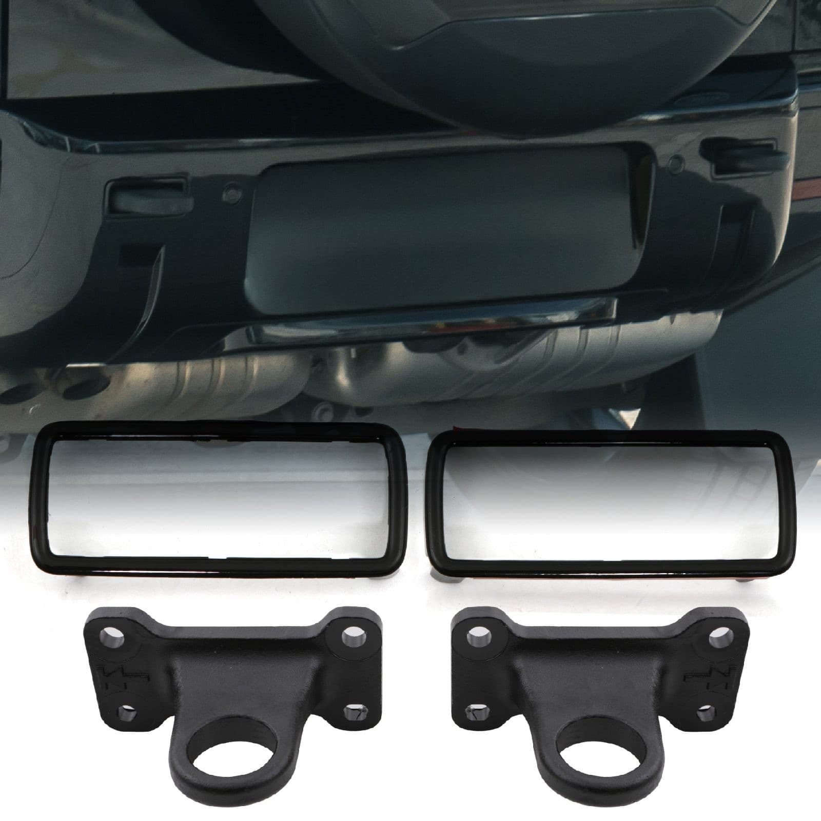Black metal rear tow hooks and surrounds designed for Land Rover Defender L663 (2020), featuring a sturdy construction with a sleek finish and rectangular cutouts for easy installation.