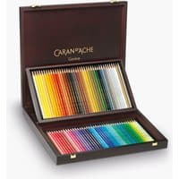 Wooden box set of 80 Caran d'Ache Prismalo watersoluble pencils, arranged in vibrant colors with gold logo inside lid.