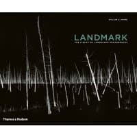 Black hardcover book "Landmark" with white tree silhouettes on the cover.