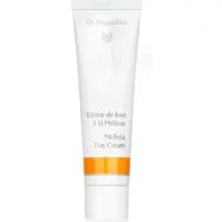 White tube of Dr Hauschka Melissa Day Cream 30ml with orange accent and silver cap.