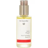 Clear glass bottle with gold cap, Dr Hauschka Rose Nurturing Body Oil label, red accent, 75ml.