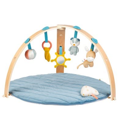 Soft blue playmat with a wooden arch, featuring colorful hanging toys including a mirror, a sun, and plush animals, designed for infant play and stimulation.