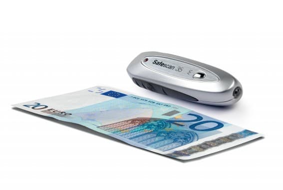 Grey and silver Safescan 35 counterfeit bill detector placed next to a 20 Euro banknote, highlighting its compact design and electronic features.