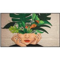 Philips 75-inch digital signage display with vibrant artwork of a face and green leaves, slim black frame