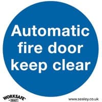 Blue circular sign with white text "Automatic fire door keep clear," Sealey branding at bottom. Pack of 10.