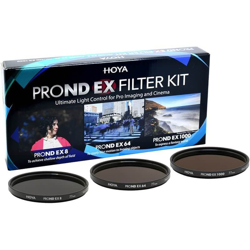 Three circular ND filters labeled Hoya PRO ND EX 8, 64, and 1000, displayed in front of a black box featuring colorful images and product details on a blue background.