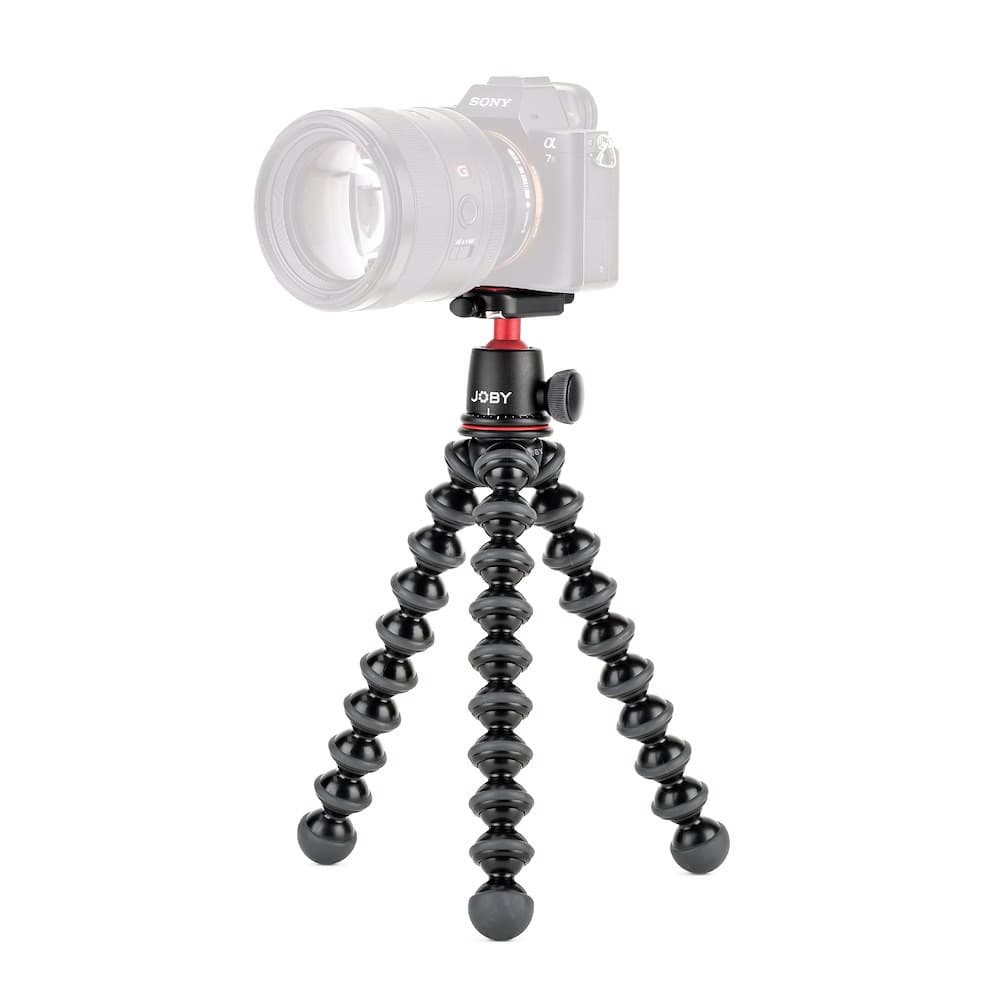 Black Joby GorillaPod 3K Kit tripod featuring flexible, bendable legs, a sturdy ball head, and a red accent, designed for digital and film cameras.