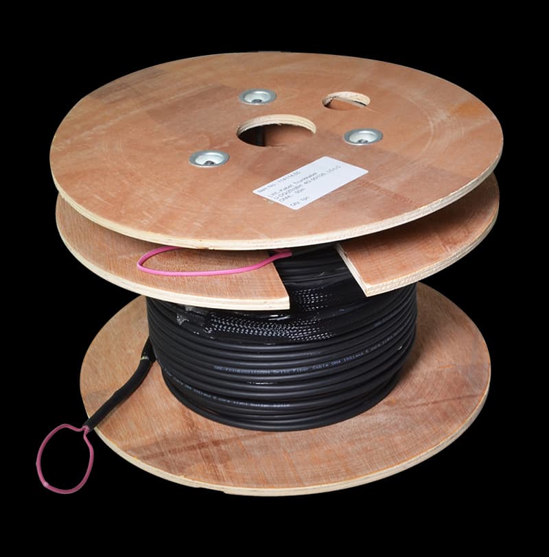 Black LogiLink FT1U120 InfiniBand/fibre optic cable on a wooden spool, featuring a central hole and labeled with product details, designed for high-speed data transmission.