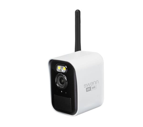 Compact white security camera with a black front, featuring a lens, two LED lights, and an antenna for wireless connectivity, labeled "Swann 4K MR."