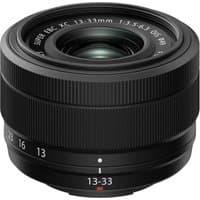 Black Fujifilm XC13-33mm F3.5-6.3 OIS lens with textured focus ring and white markings on the barrel.