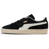 Black Puma Suede sneaker with white stripe, beige sole, and gold logo detailing.