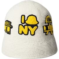 White crochet bucket hat with yellow and black "I NY" patches by Kangol.