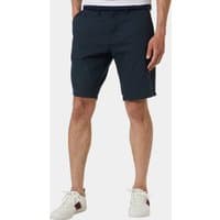 Navy blue men's shorts with side pockets, belt loops, and a tailored fit, worn with white sneakers.