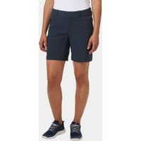Navy Helly Hansen women's deck shorts with front pockets and button closure, worn with navy sneakers.