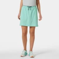 Green Helly Hansen women's hiking skort with drawstring waist, mid-thigh length, and lightweight fabric.
