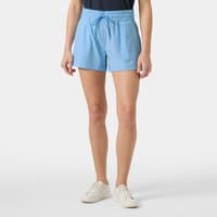 Blue Helly Hansen women's Thalia shorts, size S, with elastic waistband and drawstring, worn by model with white sneakers.