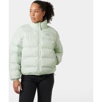 Green Helly Hansen women's reversible puffer jacket, quilted design, high collar, worn by model, size XL.
