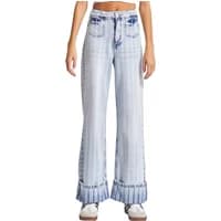 High-waisted straight jeans with blue vertical stripes, front pockets, and cuffed hems worn by a woman.