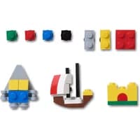 Colorful LEGO-style Jibbitz charms for Crocs, including boat, castle, and geometric shapes in various colors.