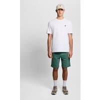 Green cotton sweat shorts with elastic waistband and Lyle & Scott logo, worn by a model with a white tee and cap.