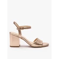 Metallic leather heeled sandals by Ryłko, featuring ankle strap and block heel in a shimmering gold tone.