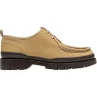 Beige leather moccasin by Kleman with thick black sole, lace-up front, and stitched detailing.