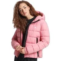 Pink Superdry Spirit Sports puffer jacket with hood, black zipper, and logo on chest.