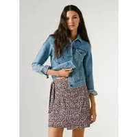 Pepe Jeans Nayara short skirt, floral pattern, wrap style, tied waist, worn with a denim jacket.