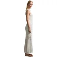 White sleeveless long crochet dress by Stefanel, featuring intricate openwork patterns and a fitted silhouette.