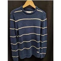 Blue striped sweater by Blend with white horizontal lines and ribbed cuffs, displayed on a wooden hanger.