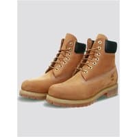 Yellow Timberland Premium 6 Inch Waterproof Boots with black padded collar and rugged sole, size 7.