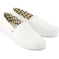 White cotton espadrilles with zigzag interior pattern and slip-on design by TOMS.