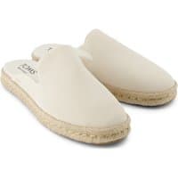 Light sand leather mules with closed toe, slip-on design, and braided jute sole by TOMS.