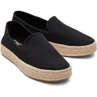 Black TOMS Carolina slippers with woven jute soles and slip-on design.