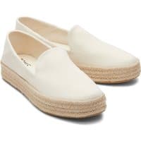 Natural TOMS Carolina Slipper for women, slip-on style with a woven jute platform sole and soft fabric upper.