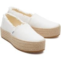 White TOMS Valencia espadrille with frayed edges, jute-wrapped platform sole, and slip-on design.