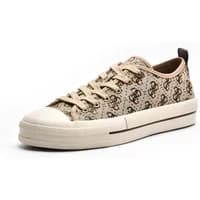 Beige Guess Carey trainers with monogram pattern, white rubber sole, and lace-up front.