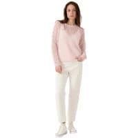 Pink Artlove Eloira sweater with lace detailing, long sleeves, worn by a woman with white pants and sneakers.