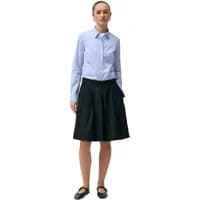 Blue button-up women's shirt Diverse Zairo, long sleeves, pointed collar, paired with black skirt.