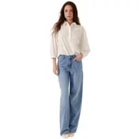 White Artlove Jasmeen women's blouse, long sleeves, button-up front, paired with light blue wide-leg jeans.