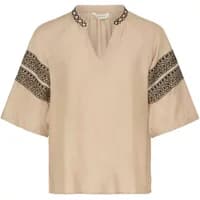 Beige women's blouse by b.young with black lace trim on sleeves and neckline, featuring a V-neck and short sleeves.